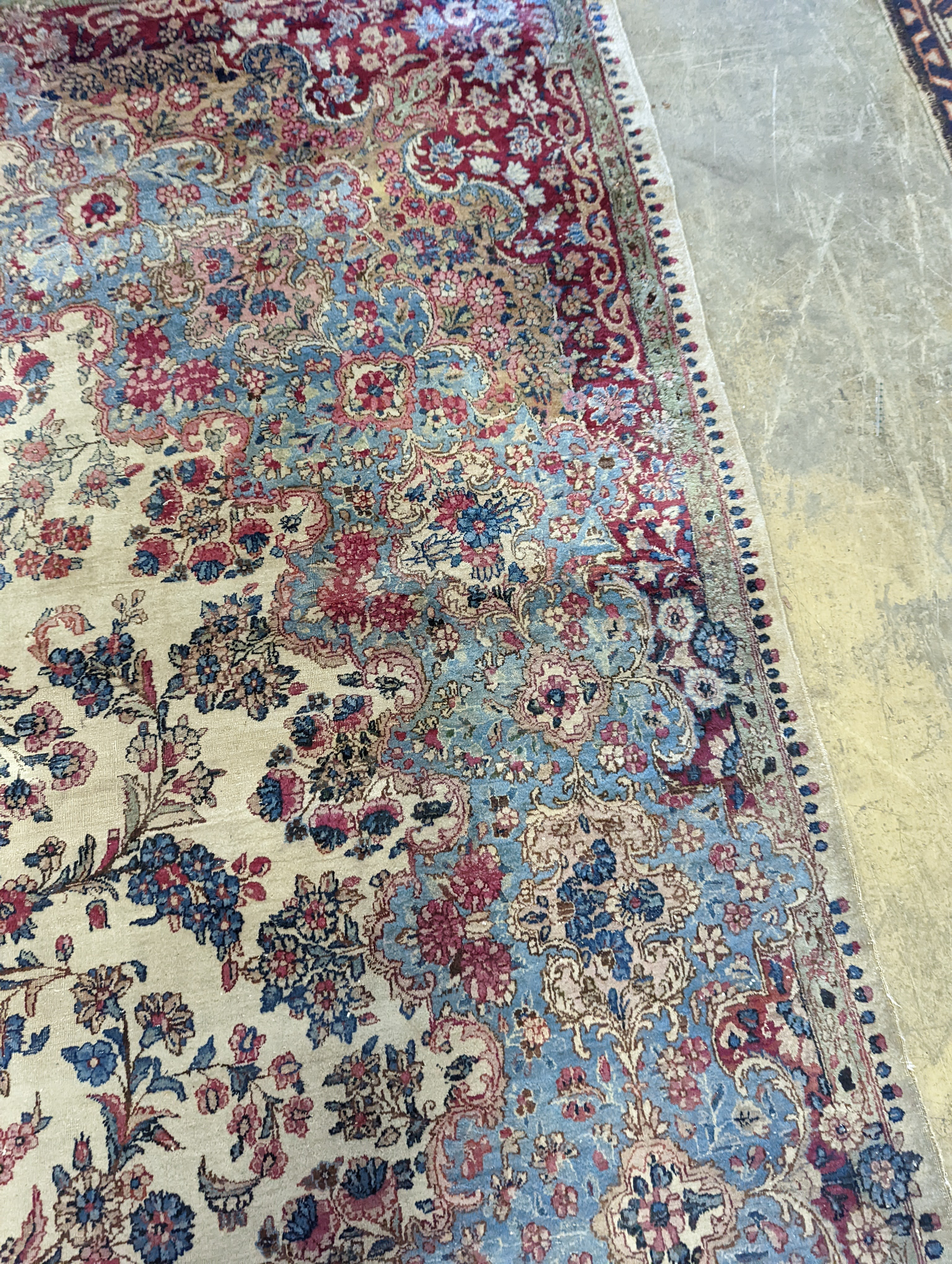 A North West Persian ivory ground carpet, 396 x 290cm